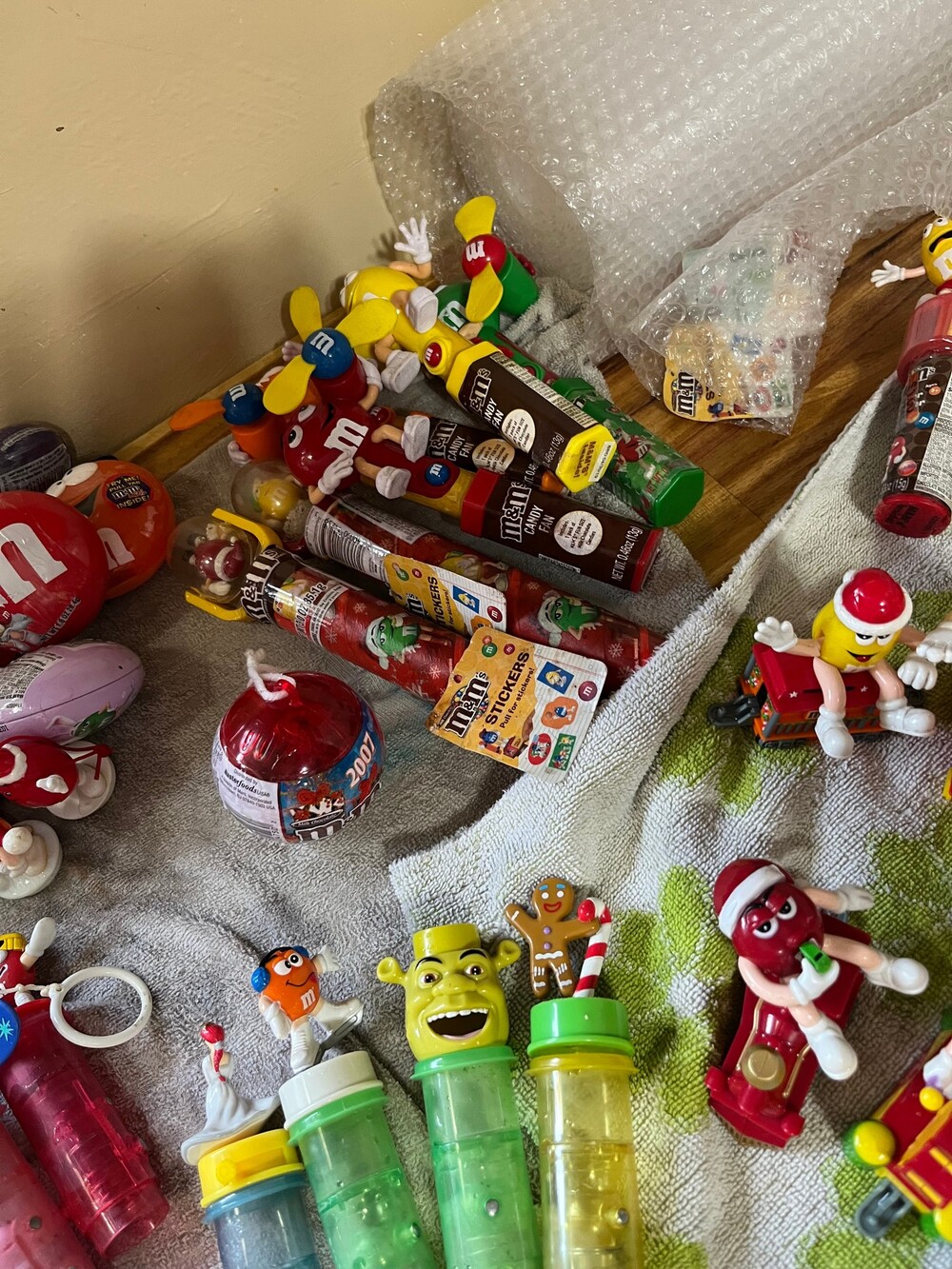 A Surprise package of 5 random collectible M&M Characters candy tops, candy hold